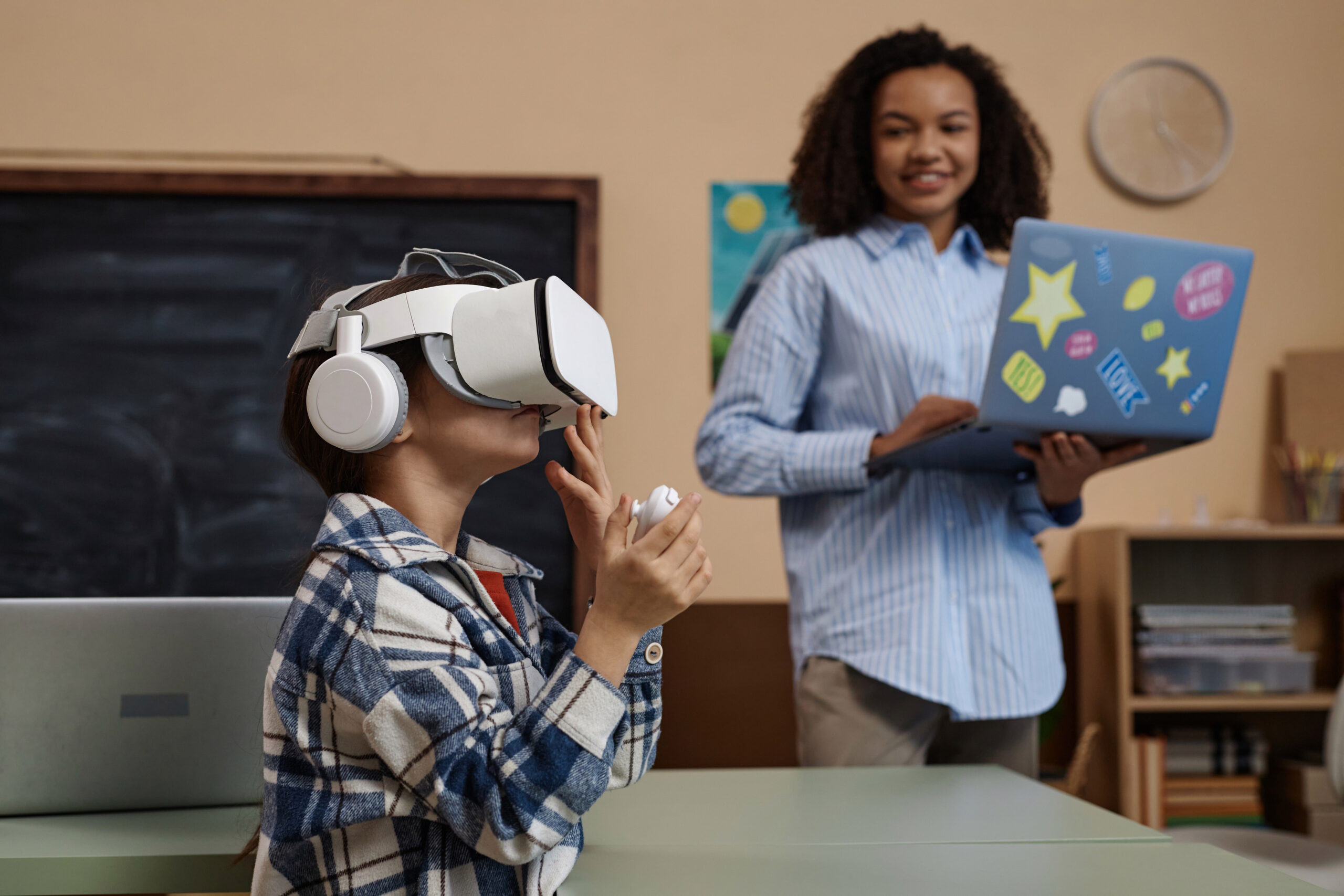 Girl wearing VR headset in class Side view portrait of little girl wearing VR headset in class and enjoying futuristic learning technology.